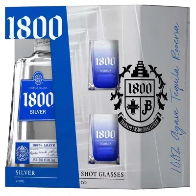 1800 Silver Tequila Shot Glass Gift Set featuring a 750ml bottle and two branded blue-rimmed shot glasses in premium packaging