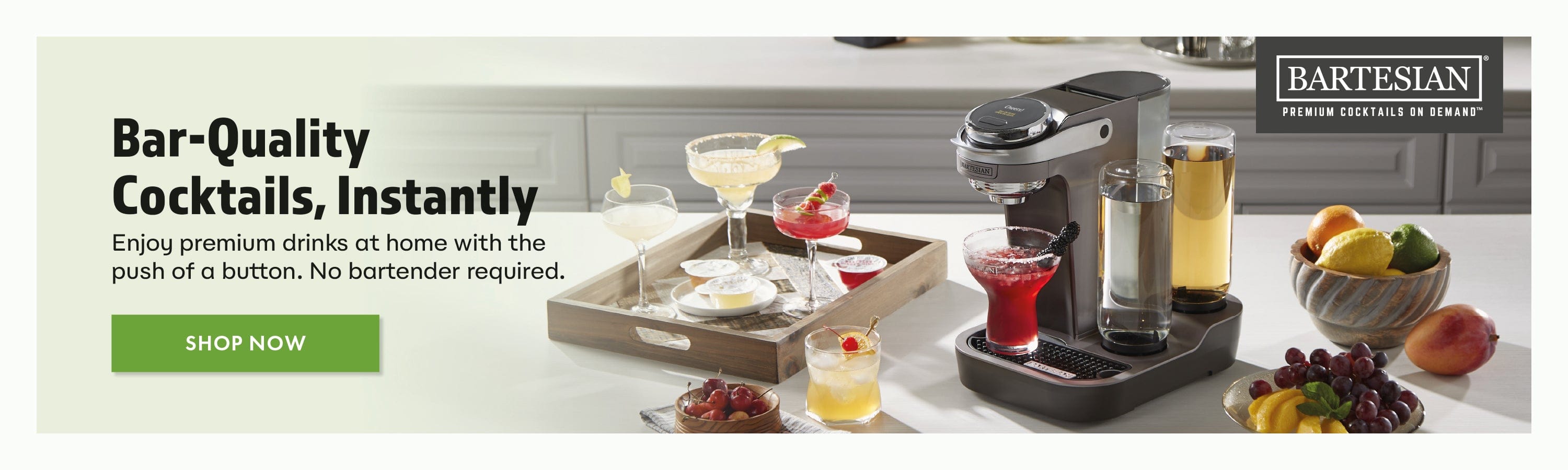 Bartesian cocktail mixer with drinks and ingredients on a table, featuring the Bartesian brand.