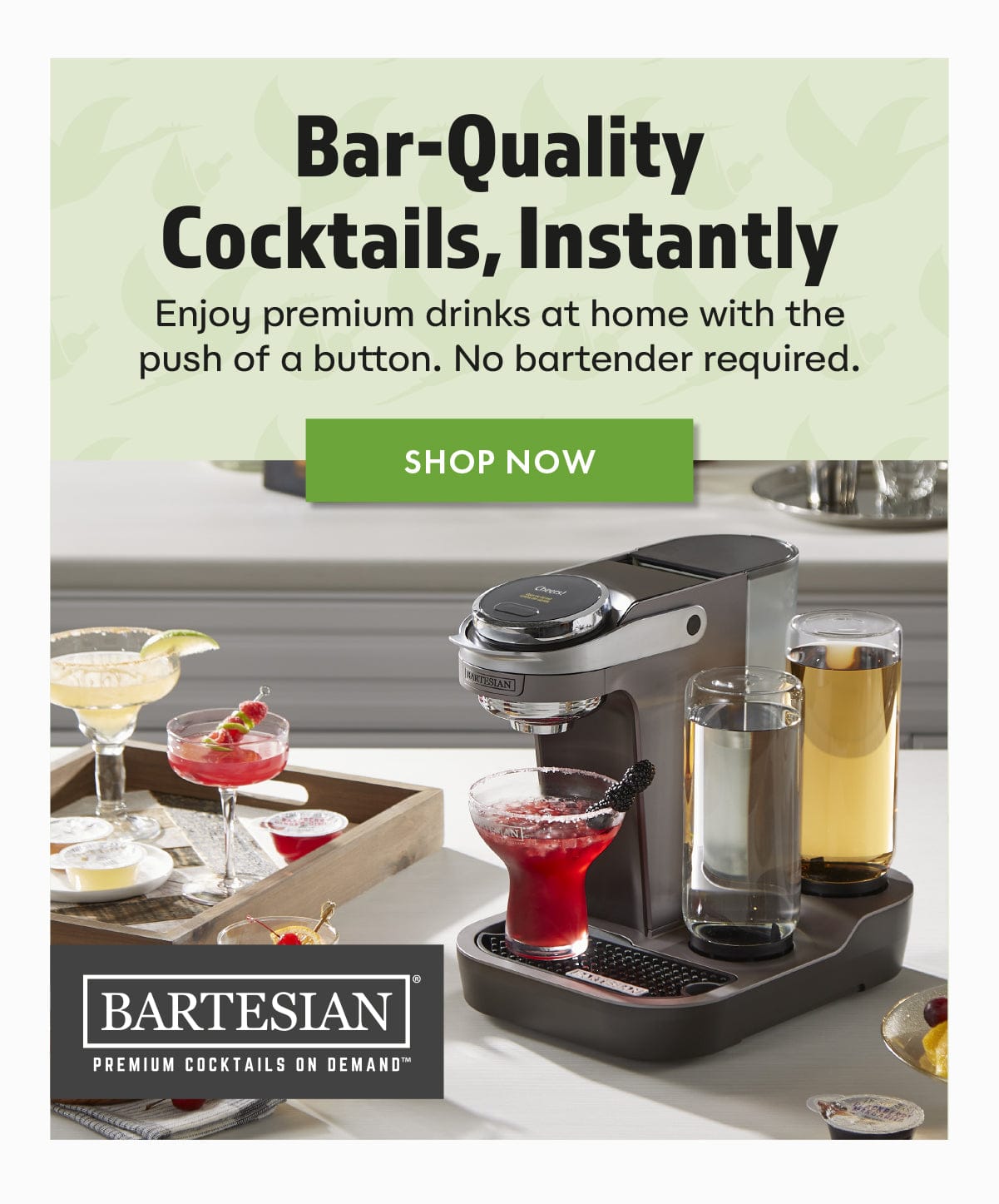 Bartesian cocktail machine with drinks on a counter, promotional text above.