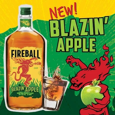 Fireball Blazin’ Apple Whisky promotional image – bottle with shot glass, apple, and Fireball dragon design highlighting new spicy apple flavor.
