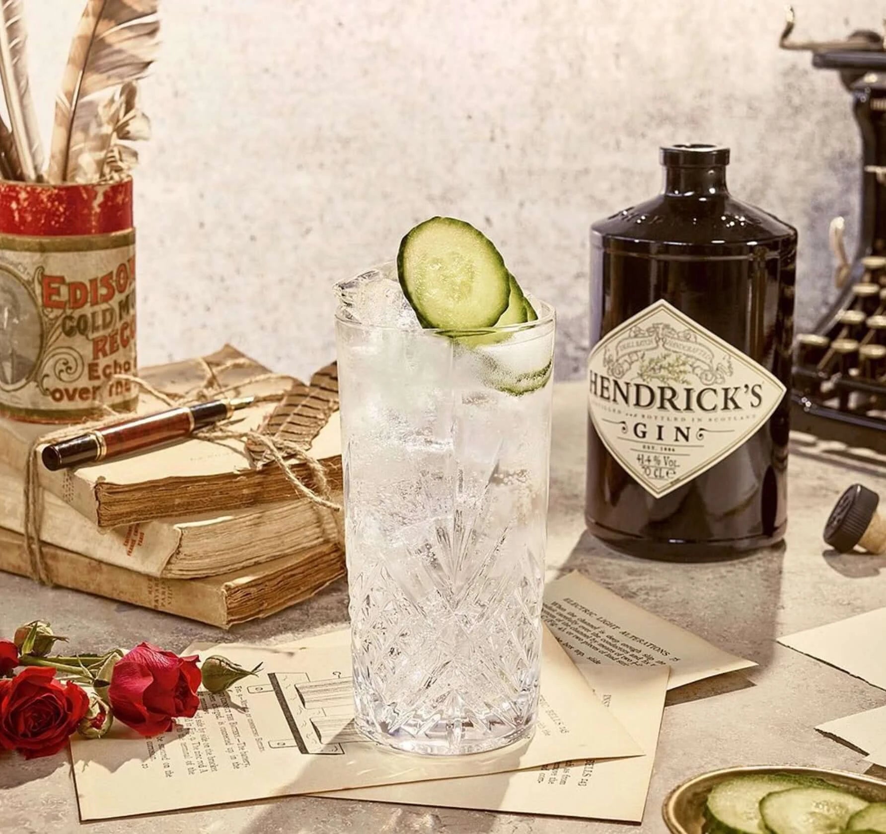 Hendrick’s Gin with vintage cocktail setup – classic gin and tonic with cucumber garnish