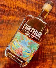 Whiskey bottle with colorful label on a wooden surface