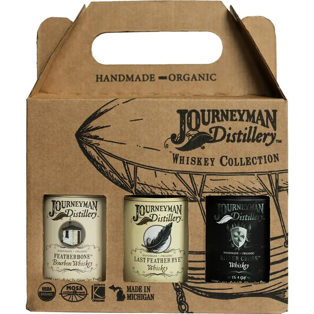 Journeyman Distillery whiskey collection packaging with three bottles inside.