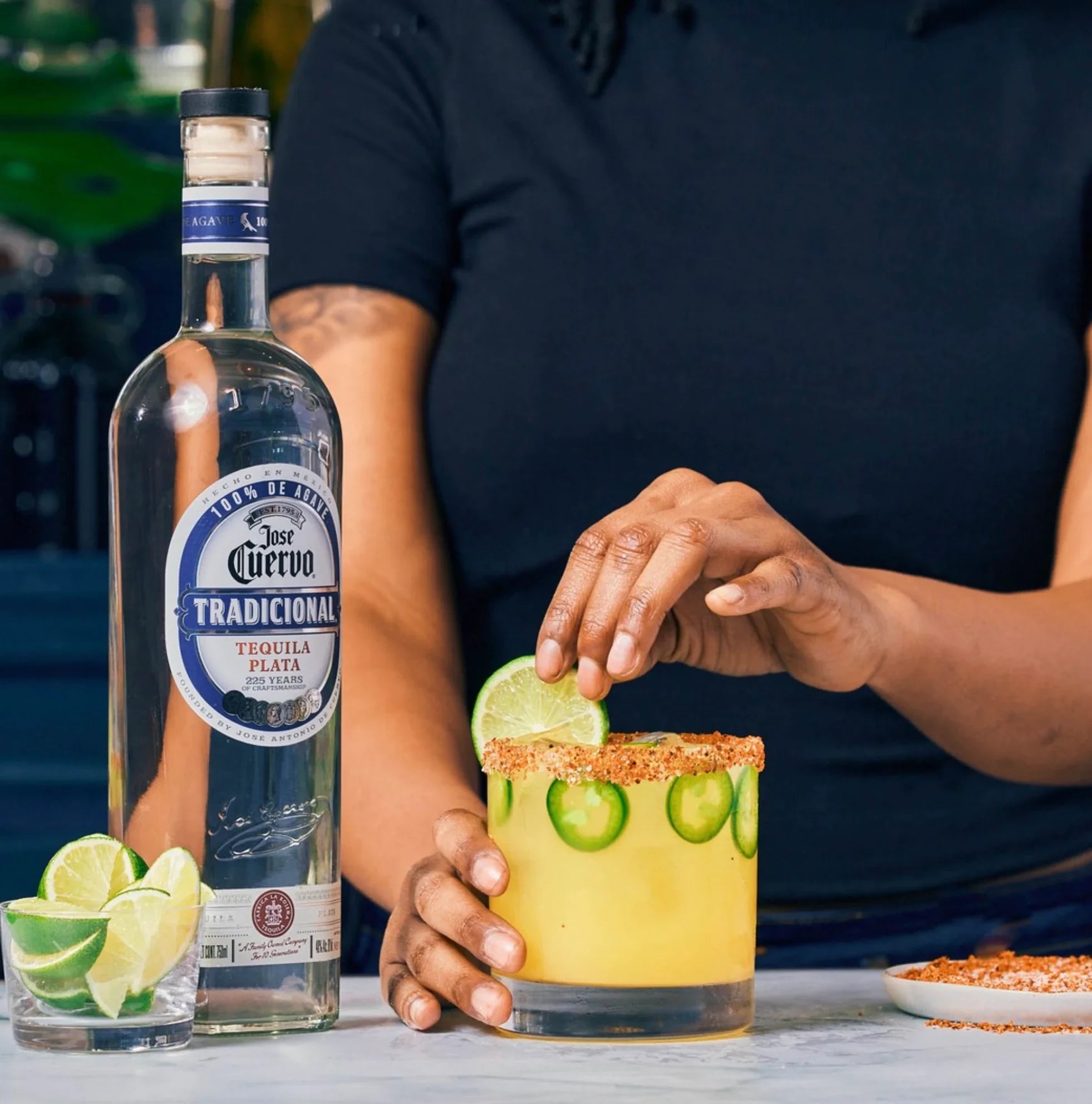 Jose Cuervo Tradicional Plata Tequila with spicy margarita garnished with lime and jalapeños