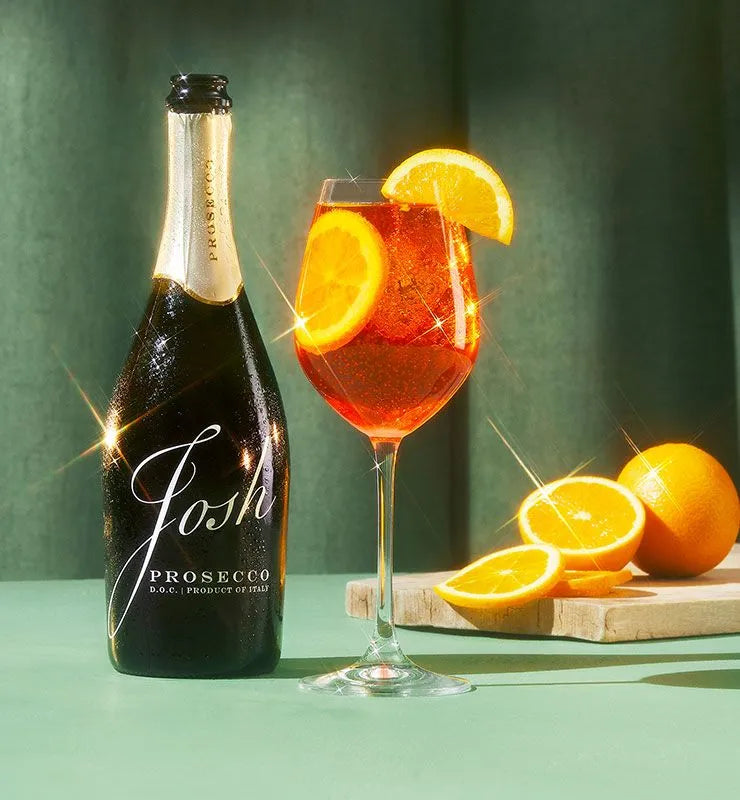 Josh Cellars Prosecco DOC with sparkling orange cocktail and fresh orange slices, Italian sparkling wine lifestyle image
